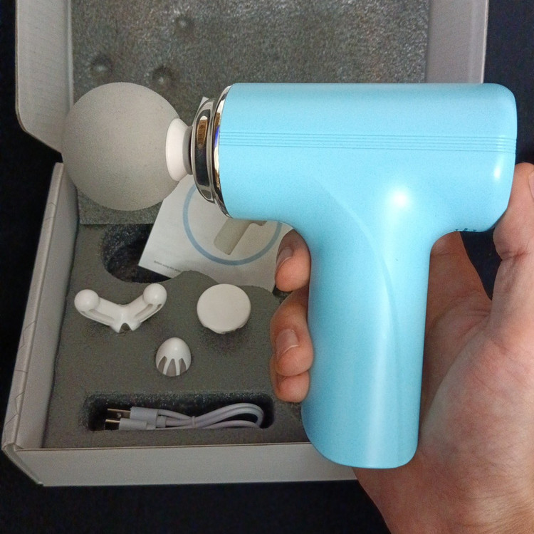 ماساژور تفنگی MINI MASSAGE GUN مدل MG-203 دارای 4 عدد سری ماساژ موجود در فروشگاه قشمی شاپ QESHMISHOP